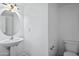 Neutral toned half bathroom with pedestal sink and modern fixtures at 1367 S Country Club Dr # 1221, Mesa, AZ 85210