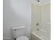 Bathroom featuring a toilet, bathtub, and tiled walls at 1367 S Country Club Dr # 1221, Mesa, AZ 85210