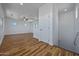 Open bonus room with wood-look floors, bright white walls, and a ceiling fan at 1367 S Country Club Dr # 1221, Mesa, AZ 85210