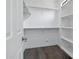 Spacious walk-in closet with built in shelving and wood-look floors at 1367 S Country Club Dr # 1221, Mesa, AZ 85210