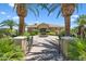 Community clubhouse featuring desert landscaping, paved walkways, a fountain, and shade trees at 1367 S Country Club Dr # 1221, Mesa, AZ 85210