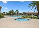 Inviting community hot tub surrounded by lush landscaping and a view of the main pool, ideal for unwinding at 1367 S Country Club Dr # 1221, Mesa, AZ 85210