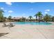 Beautiful community pool featuring palm trees, lounge chairs, and well-maintained landscaping, perfect for relaxation and enjoyment at 1367 S Country Club Dr # 1221, Mesa, AZ 85210