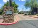 A stone monument at the entrance to the community features the address at 1367 S Country Club Dr # 1221, Mesa, AZ 85210