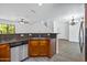 Open kitchen with stainless steel appliances and a view into the living area at 1367 S Country Club Dr # 1221, Mesa, AZ 85210