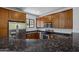 Spacious kitchen boasts granite countertops, stainless appliances, and ample cabinet space at 1367 S Country Club Dr # 1221, Mesa, AZ 85210