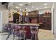 Stylish kitchen with bar seating, decorative pendant lighting, granite countertops, and ample cabinet space at 1367 S Country Club Dr # 1221, Mesa, AZ 85210