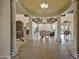 Open concept living room showcasing grand entrance with columns and decorative tiled floor, and comfortable seating arrangements at 1367 S Country Club Dr # 1221, Mesa, AZ 85210