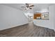 Spacious open floor plan with wood-look floors, white walls, and a kitchen area at 1367 S Country Club Dr # 1221, Mesa, AZ 85210