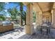 Outdoor seating area with tables, chairs, a grill, and lush greenery, creating a relaxing ambiance for dining at 1367 S Country Club Dr # 1221, Mesa, AZ 85210