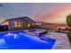 Inviting backyard featuring a pool, spa, and an outdoor seating area perfect for entertaining at 14481 W Via Del Oro --, Surprise, AZ 85379