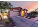 Charming single-Gathering home featuring a 2-car garage and cozy front porch, and American flag at 14481 W Via Del Oro --, Surprise, AZ 85379