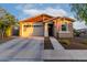 Charming single-Gathering home featuring a 2-car garage and cozy front porch, and American flag at 14481 W Via Del Oro --, Surprise, AZ 85379