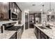Stylish kitchen features stainless steel appliances, subway tile backsplash, and granite countertops at 14481 W Via Del Oro --, Surprise, AZ 85379