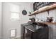 Well-organized laundry room with modern washer and dryer and stylish decor at 14481 W Via Del Oro --, Surprise, AZ 85379