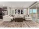 Living room with oversized sectional sofa, stylish rug, and stainless steel appliances in the background at 14481 W Via Del Oro --, Surprise, AZ 85379
