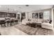 Open floor plan showcases a kitchen island adjacent to a cozy living room with natural lighting at 14481 W Via Del Oro --, Surprise, AZ 85379