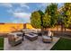 Cozy outdoor patio with comfortable seating and a fire pit, ideal for relaxation and gatherings at 14481 W Via Del Oro --, Surprise, AZ 85379