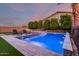 Stunning pool area with lounge chairs, spa, and well-maintained landscaping at 14481 W Via Del Oro --, Surprise, AZ 85379