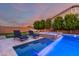 Beautiful pool with lounge chairs, spa, artificial turf and palm trees at 14481 W Via Del Oro --, Surprise, AZ 85379
