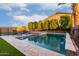 Lovely pool and spa area surrounded by lush greenery, perfect for relaxation and recreation at 14481 W Via Del Oro --, Surprise, AZ 85379