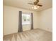 Neutral bedroom featuring a ceiling fan, window, and carpet at 1541 E Glencove St, Mesa, AZ 85203