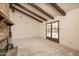 Dining area with vaulted ceilings and exposed beams, with French doors opening to the backyard pool at 1541 E Glencove St, Mesa, AZ 85203