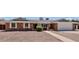 Charming brick home featuring a well-maintained yard and attached garage at 1541 E Glencove St, Mesa, AZ 85203