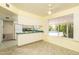 Eat-in kitchen featuring a ceiling fan and a window view of the backyard swimming pool at 1541 E Glencove St, Mesa, AZ 85203