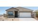 Charming single-story home featuring a two-car garage and desert landscaping at 15520 W Corte Del Sol Este --, Waddell, AZ 85355