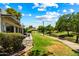 Lush backyard with manicured landscaping and serene waterway views, creating a peaceful outdoor retreat at 156 Leisure World --, Mesa, AZ 85206