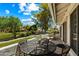 Outdoor balcony features a table set, offering a relaxing space with picturesque views of the community at 156 Leisure World --, Mesa, AZ 85206