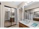 Bathroom featuring dual mirrors, wooden vanity, and sleek mirrored closet doors at 156 Leisure World --, Mesa, AZ 85206