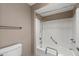Clean bathroom showcasing a tub/shower combination with grab bars and a neutral color scheme at 156 Leisure World --, Mesa, AZ 85206