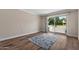 Light and airy bedroom featuring a sliding glass door leading to the patio and wood floors at 156 Leisure World --, Mesa, AZ 85206