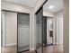 Spacious closet featuring mirrored doors and ample storage, reflecting the adjacent hallway at 156 Leisure World --, Mesa, AZ 85206
