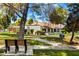 A charming property showcasing a well-kept front lawn and inviting walkway at 156 Leisure World --, Mesa, AZ 85206