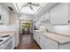 Bright kitchen with white cabinets, modern appliances, and recessed lighting at 156 Leisure World --, Mesa, AZ 85206