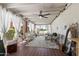 Inviting covered patio with elegant wicker seating, flowing white drapes, and an outdoor view at 156 Leisure World --, Mesa, AZ 85206