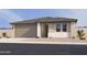 Charming single-story home featuring a neutral color palette, a two-car garage, and low-maintenance landscaping at 16189 W Bajada Rd, Surprise, AZ 85387