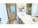 The bathroom features a double sink, vinyl floors, and tile shower at 1630 W Pecan Rd, Phoenix, AZ 85041