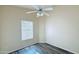 Bright bedroom features a ceiling fan, vinyl floors, and lots of natural light at 1630 W Pecan Rd, Phoenix, AZ 85041