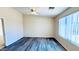 Bright bedroom features a ceiling fan, vinyl floors, and lots of natural light at 1630 W Pecan Rd, Phoenix, AZ 85041