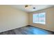 Bright bedroom features a ceiling fan, vinyl floors, and lots of natural light from the window at 1630 W Pecan Rd, Phoenix, AZ 85041