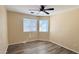Bright bedroom features a ceiling fan, vinyl floors, and lots of natural light at 1630 W Pecan Rd, Phoenix, AZ 85041