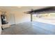 Spacious garage with an open door, water heater, and plenty of parking space at 1630 W Pecan Rd, Phoenix, AZ 85041