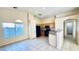 Bright kitchen featuring tile floors, wood cabinets, and granite countertops at 1630 W Pecan Rd, Phoenix, AZ 85041