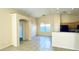 Kitchen with wood cabinetry, granite countertops, and tile flooring at 1630 W Pecan Rd, Phoenix, AZ 85041