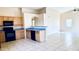 Kitchen with black appliances, granite countertops, and tile flooring at 1630 W Pecan Rd, Phoenix, AZ 85041