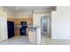 Updated kitchen features stainless steel appliances, granite counters, and beautiful wood cabinets at 1630 W Pecan Rd, Phoenix, AZ 85041
